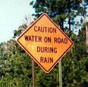 caution_water_on_road.jpg
